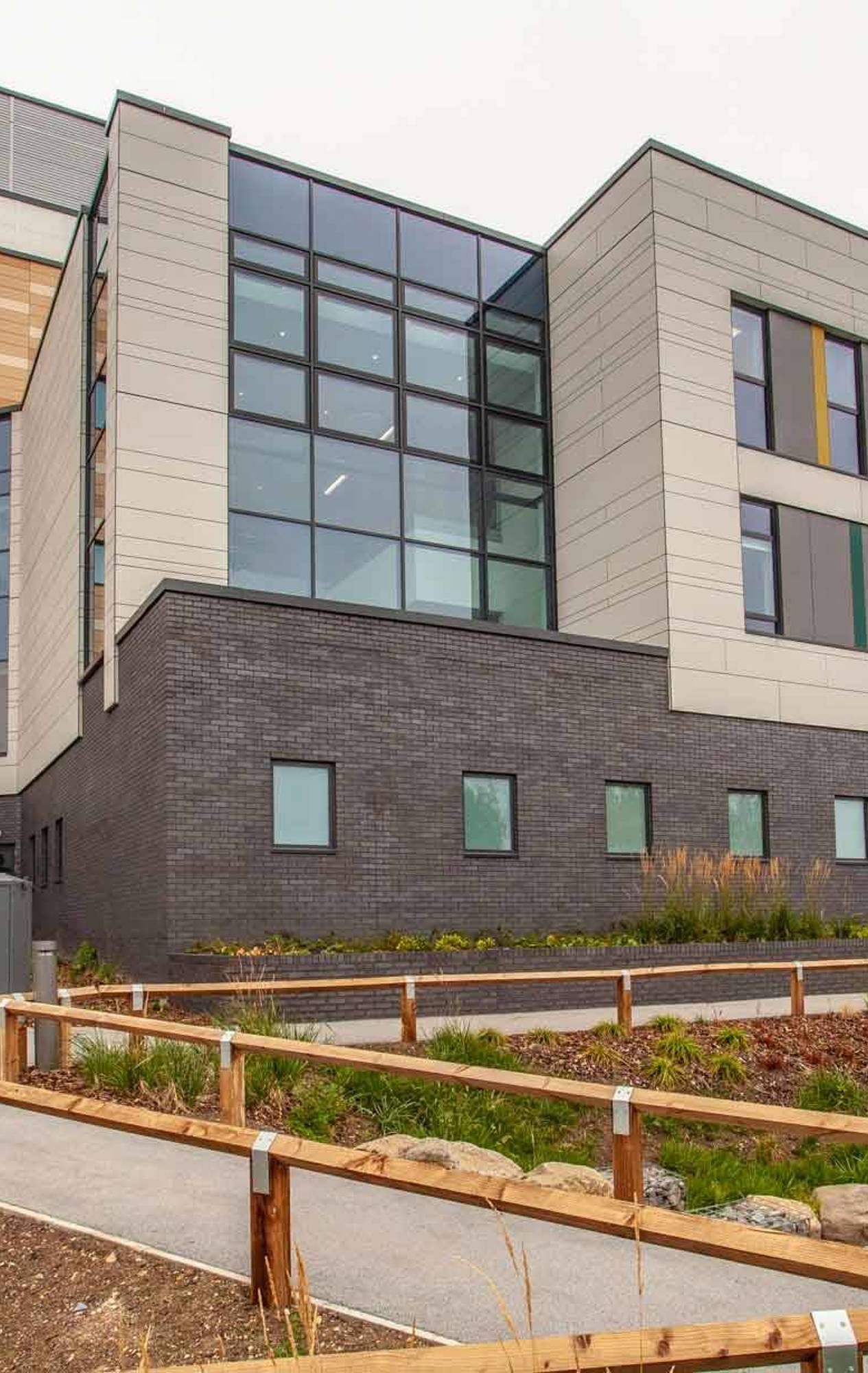Modern and welcoming reception area of Chase Farm Hospital, featuring sleek design elements and digital check-in kiosks to streamline patient arrivals.